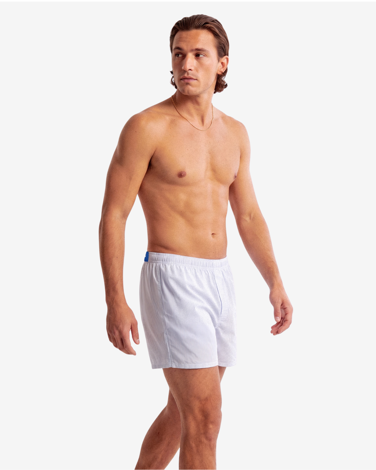 Model wearing Son of John Light Blue Pinstripe boxer shorts, side view